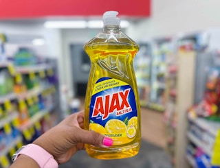 hand holding a bottle of Ajax dish soap