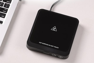 a mug warmer on a desk