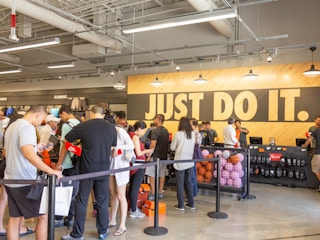 Nike store check out with customers waiting to be helped