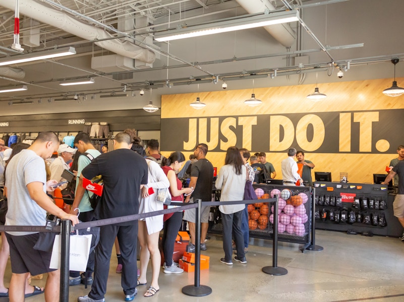 Nike store check out with customers waiting to be helped