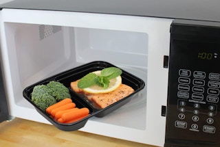 a meal in a container in a microwave