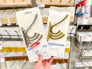 hand holding brightroom wall hooks at target
