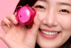 a woman holding a dr.jart+ jelly lip mask