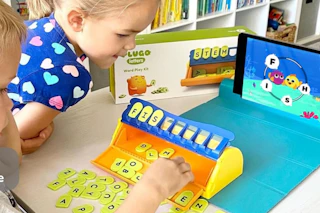 child playing with letter game