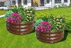 Lifestyle image of 2 round garden beds with flowers planted (brown galvanized)