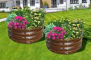 Lifestyle image of 2 round garden beds with flowers planted (brown galvanized)