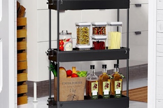 a three tier spacekeeper storage cart with pantry items in it