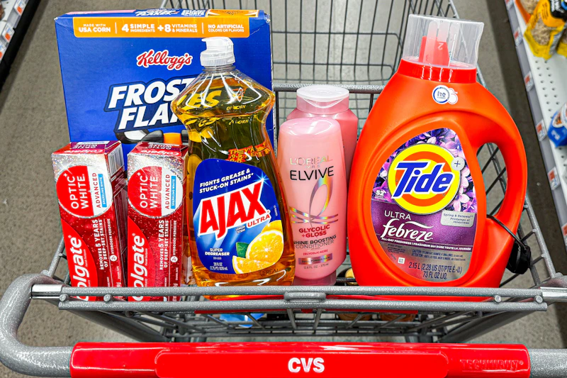 colgate toothpaste, frosted flakes cereal, ajax dish soap, loreal elvive shampoo, and tide detergent in a cart