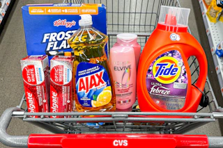 colgate toothpaste, frosted flakes cereal, ajax dish soap, loreal elvive shampoo, and tide detergent in a cart