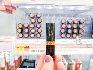 hand holding revlon super lustrous lipstick at walmart