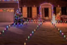 Christmas pathway lights on in front of house