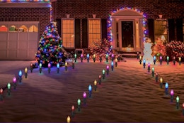 Christmas pathway lights on in front of house