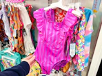 kids' swimsuits sitting on a target shelf