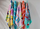 colorful beach towels on hooks