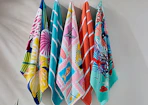 colorful beach towels on hooks