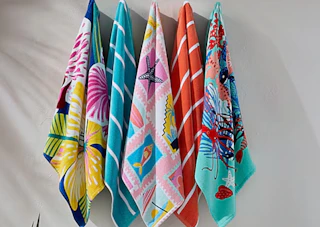 colorful beach towels on hooks