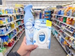 hand holding febreze products in walgreens