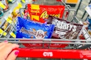 person pushing a cart with candy in it