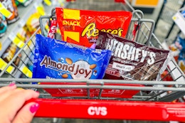 person pushing a cart with candy in it