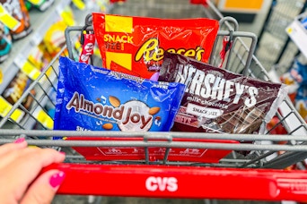 person pushing a cart with candy in it