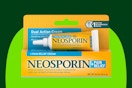A yellow and teal box and tube of Neosporin + Pain Relief 0.5 ounces