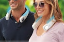 two people wearing neck fans