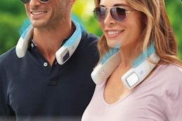 two people wearing neck fans