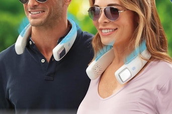 two people wearing neck fans