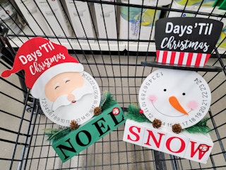 santa and snowman christmas countdowns in a cart