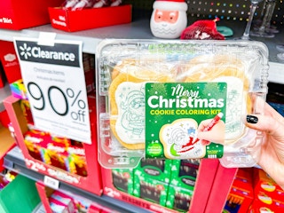 hand holding christmas cookie kit in walmart aisle