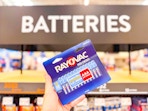 hand holding a 24-pack of rayovac aaa batteries at walmart