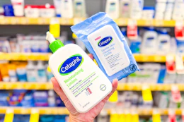 person holding cetaphil lotion and cleansing cloths