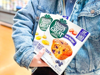 2 Veggies Made Great Muffin boxes being held by someone wearing a jean jacket in Walmart store (close up shot)