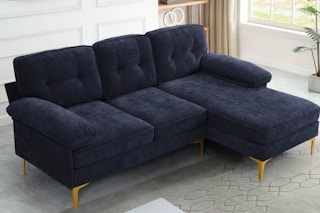sectional sofa in living room with rug underneath