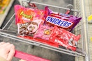 reese's, snickers, dove, rolo, and hersheys kisses valentines day candy bags in a cart