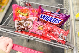 reese's, snickers, dove, rolo, and hersheys kisses valentines day candy bags in a cart