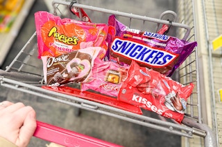 reese's, snickers, dove, rolo, and hersheys kisses valentines day candy bags in a cart