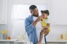 a man giving his daughter zarbee's cough syrup