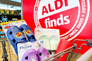 aldi brand lookalikes in a cart by the Aldi Finds sign