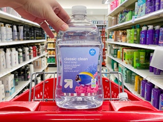 hand grabbing bottle of soap out of Target shopping cart