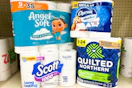 angel soft, charmin, scott, and quilted northern toilet paper packs on a shelf