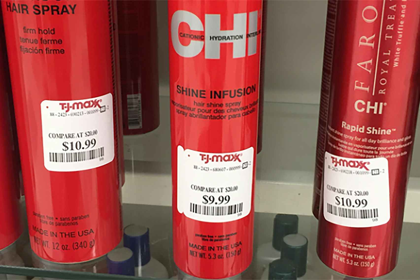 Cans of Chi Hair Spray with T.J. Maxx price tags.