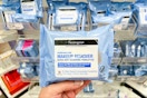 hand holding a pack of neutrogena makeup remover wipes at target