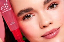 a woman holding e.l.f. jelly pop primer
