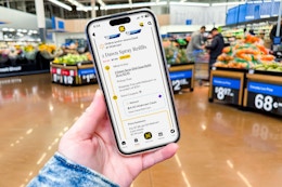 hand holding a smartphone displaying a kcl app 1-clip deal