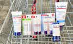 a variety of aquaphor products in a cart