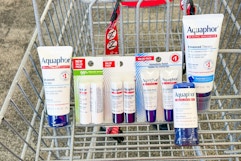 a variety of aquaphor products in a cart
