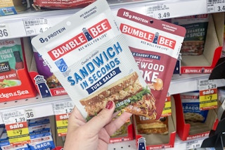 hand holding bumble bee tuna pouches