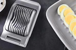 an egg slicer on a table