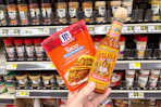 hand holding mccormick and cholula